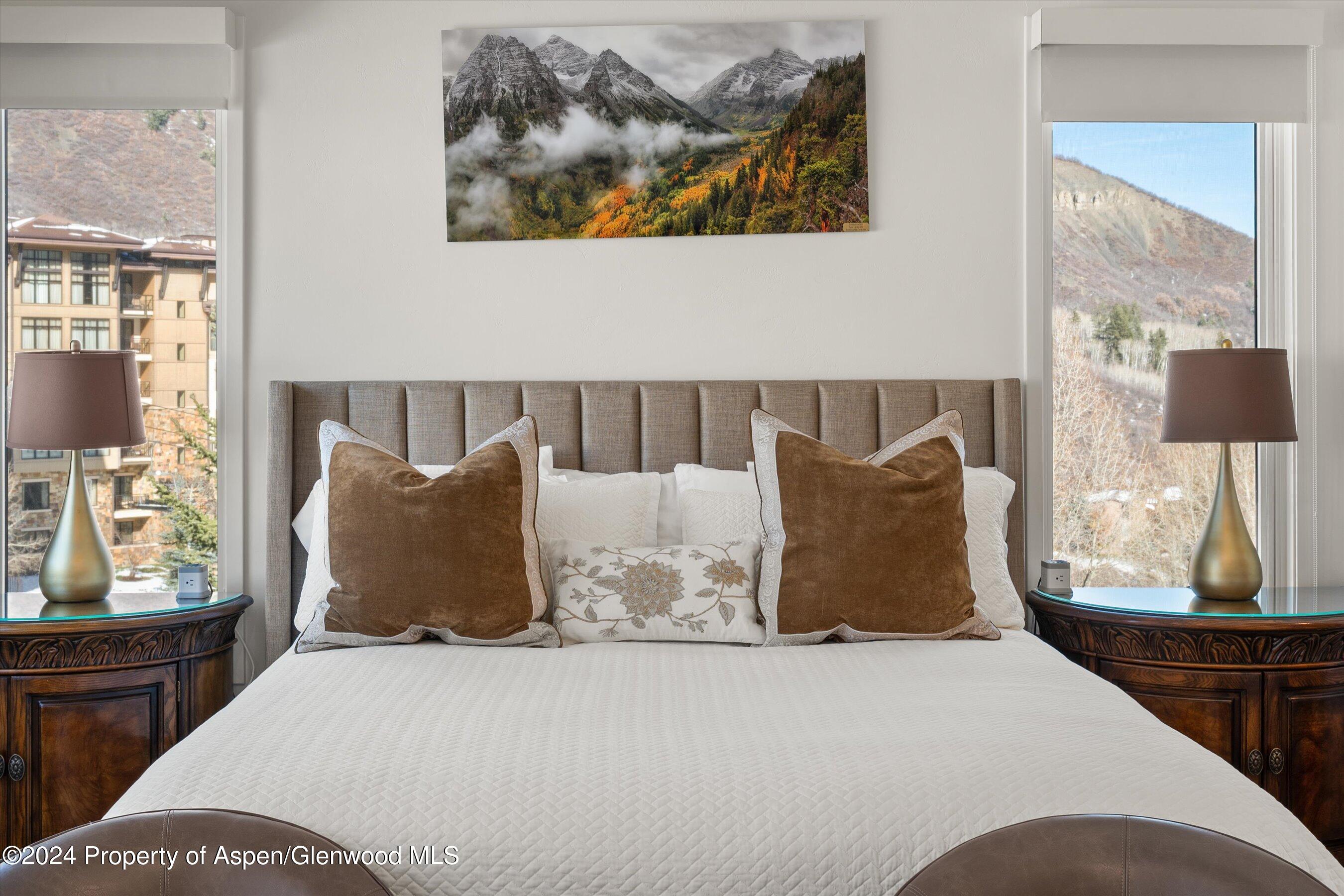 381 Ridge Road, Unit A5 Snowmass Village, CO 81615 - Photo 30 of 43 a large bed sitting in a bedroom next to a window