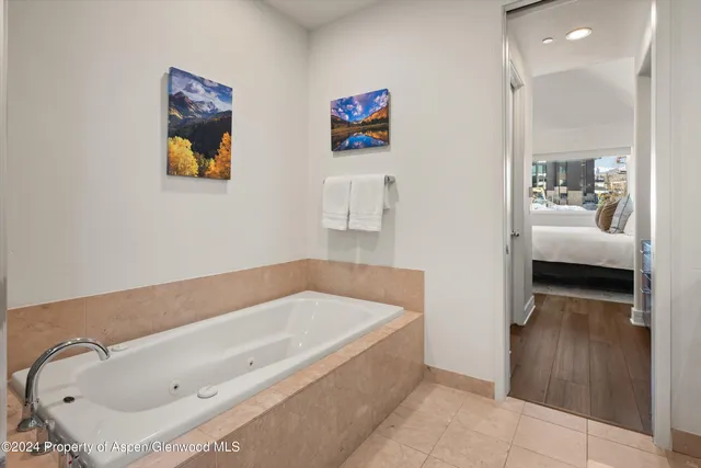 a bathroom with a tub and sink