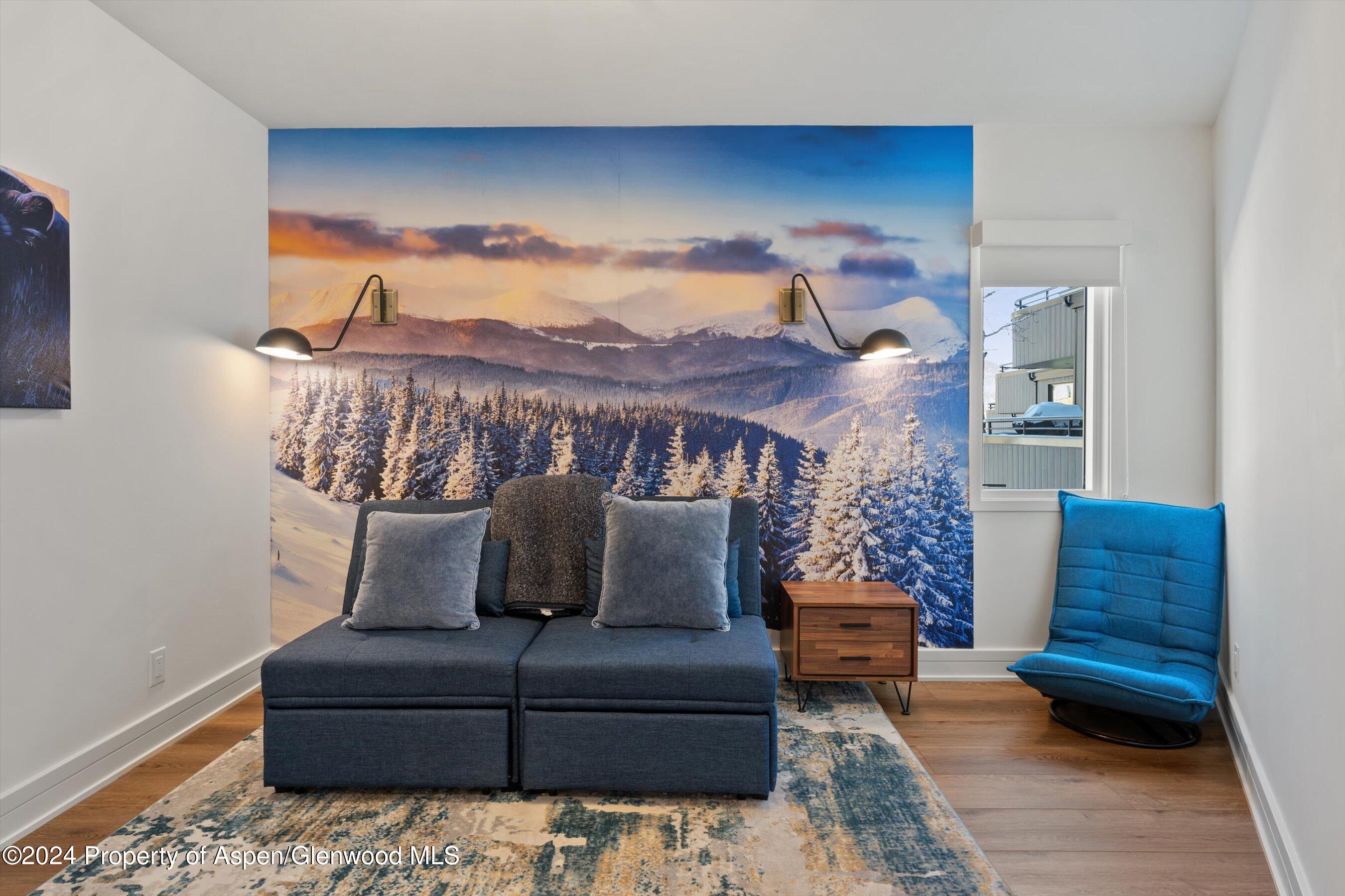 381 Ridge Road, Unit A5 Snowmass Village, CO 81615 - Photo 40 of 43 a bedroom with furniture and a potted plant