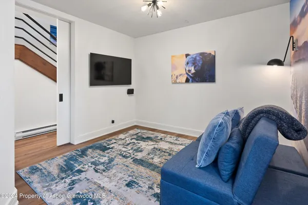 a view of a livingroom with furniture and front door