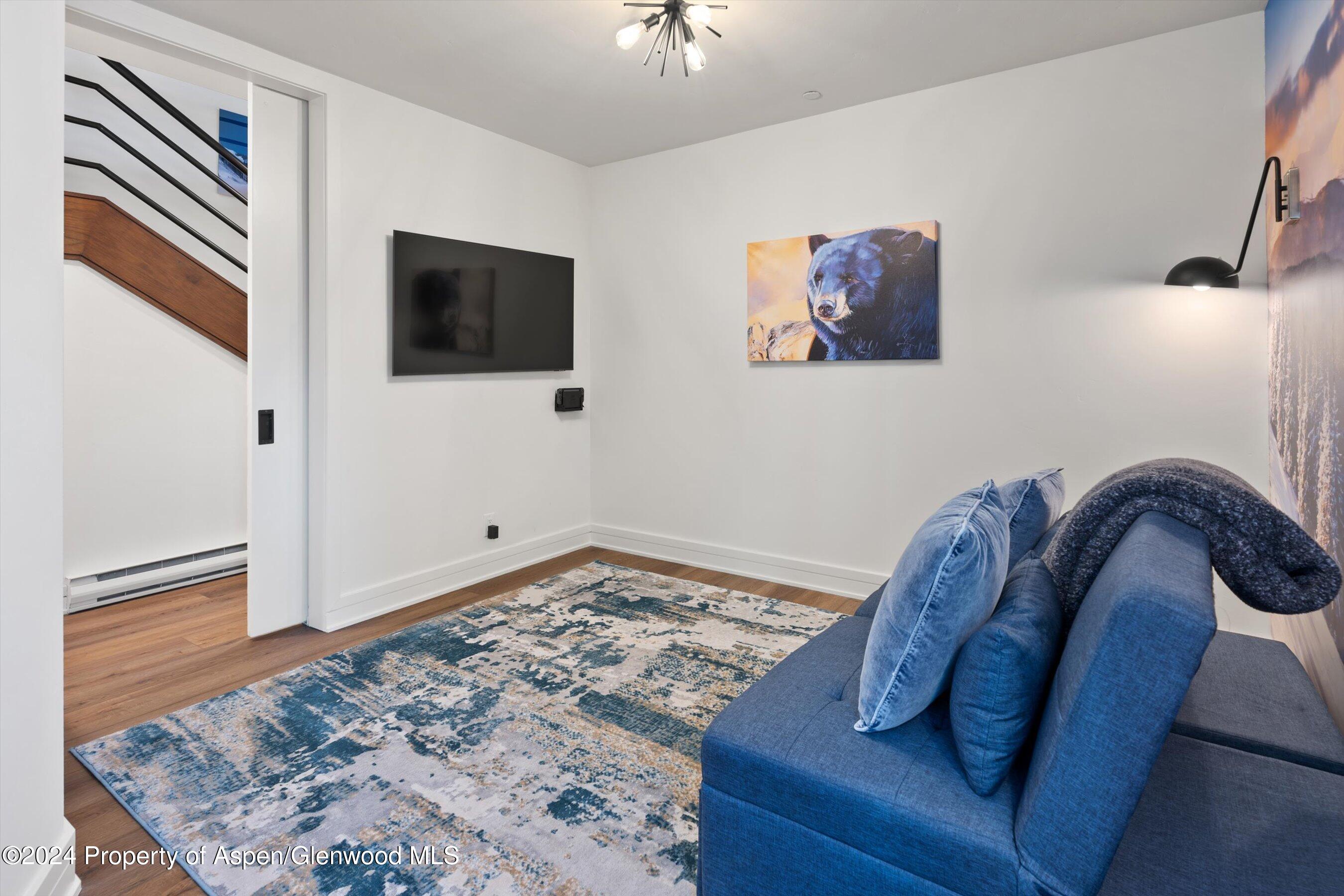 381 Ridge Road, Unit A5 Snowmass Village, CO 81615 - Photo 41 of 43 a view of a livingroom with furniture and front door