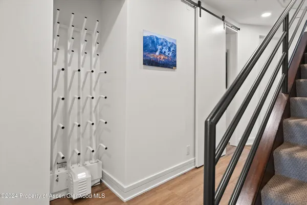 a view of an entryway with wooden floor