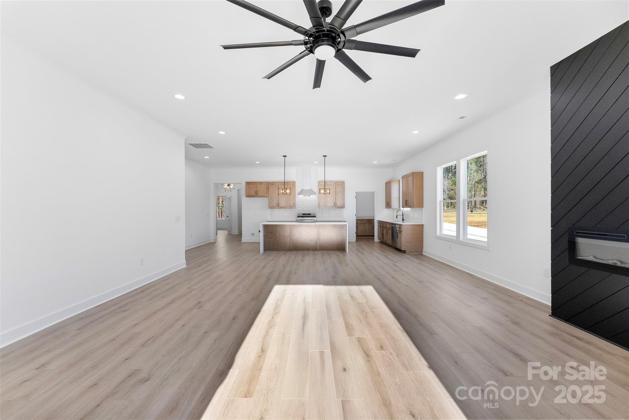 4005 Miller Road Salisbury, NC 28147 - Photo 15 of 46 a spacious bedroom with a bed and wooden floor