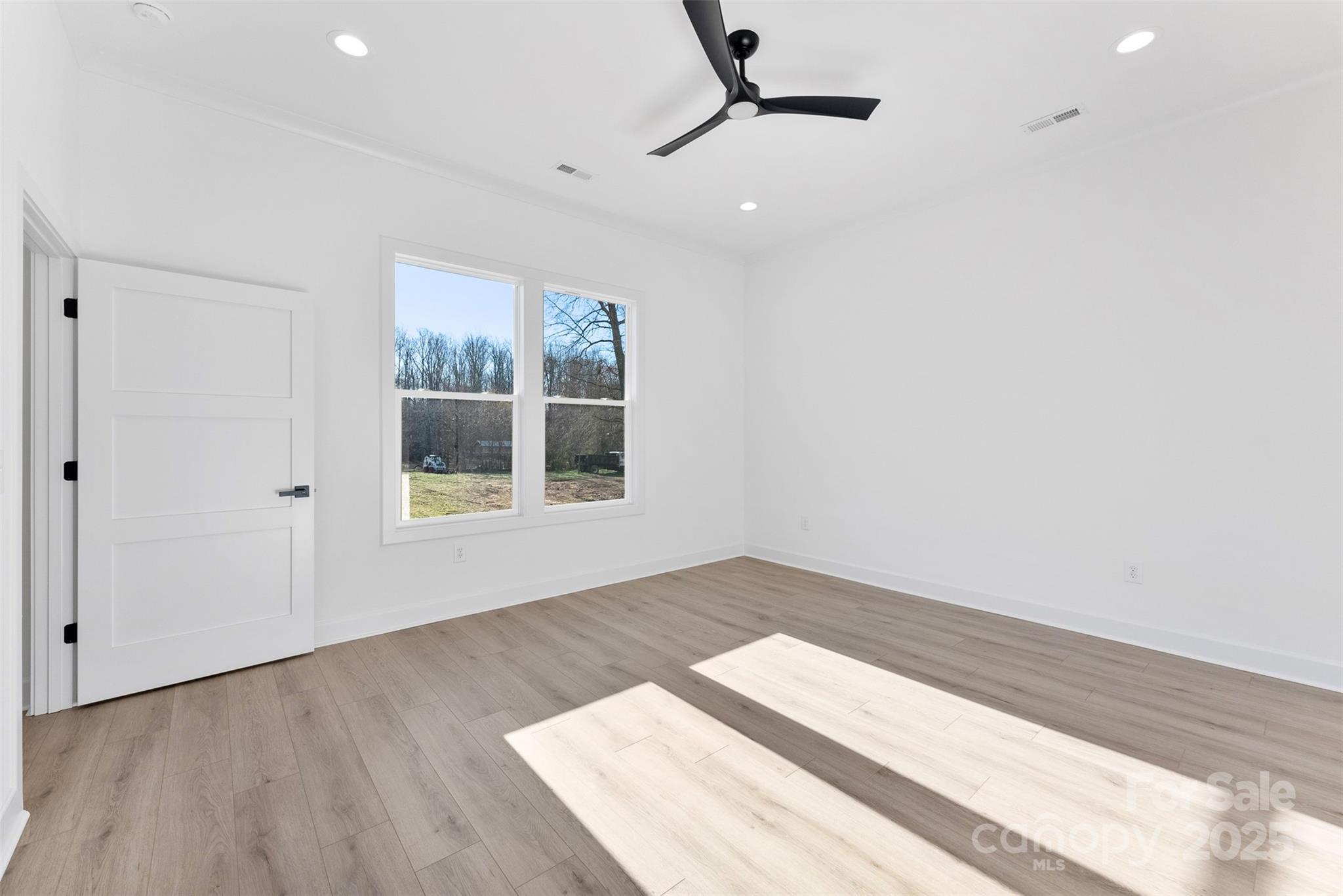 4005 Miller Road Salisbury, NC 28147 - Photo 19 of 46 an empty room with wooden floor and windows