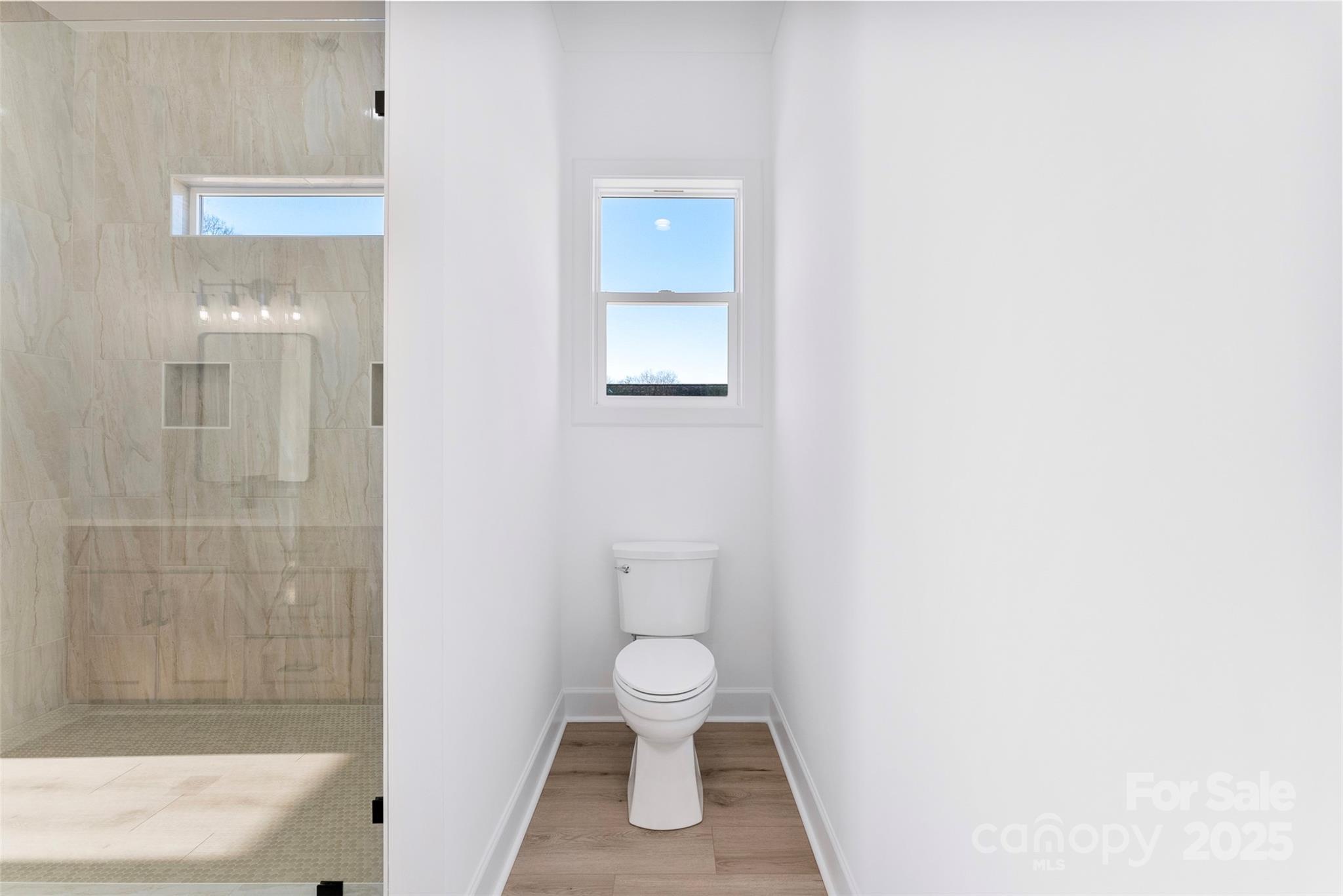 4005 Miller Road Salisbury, NC 28147 - Photo 25 of 46 a bathroom with a toilet tub and shower