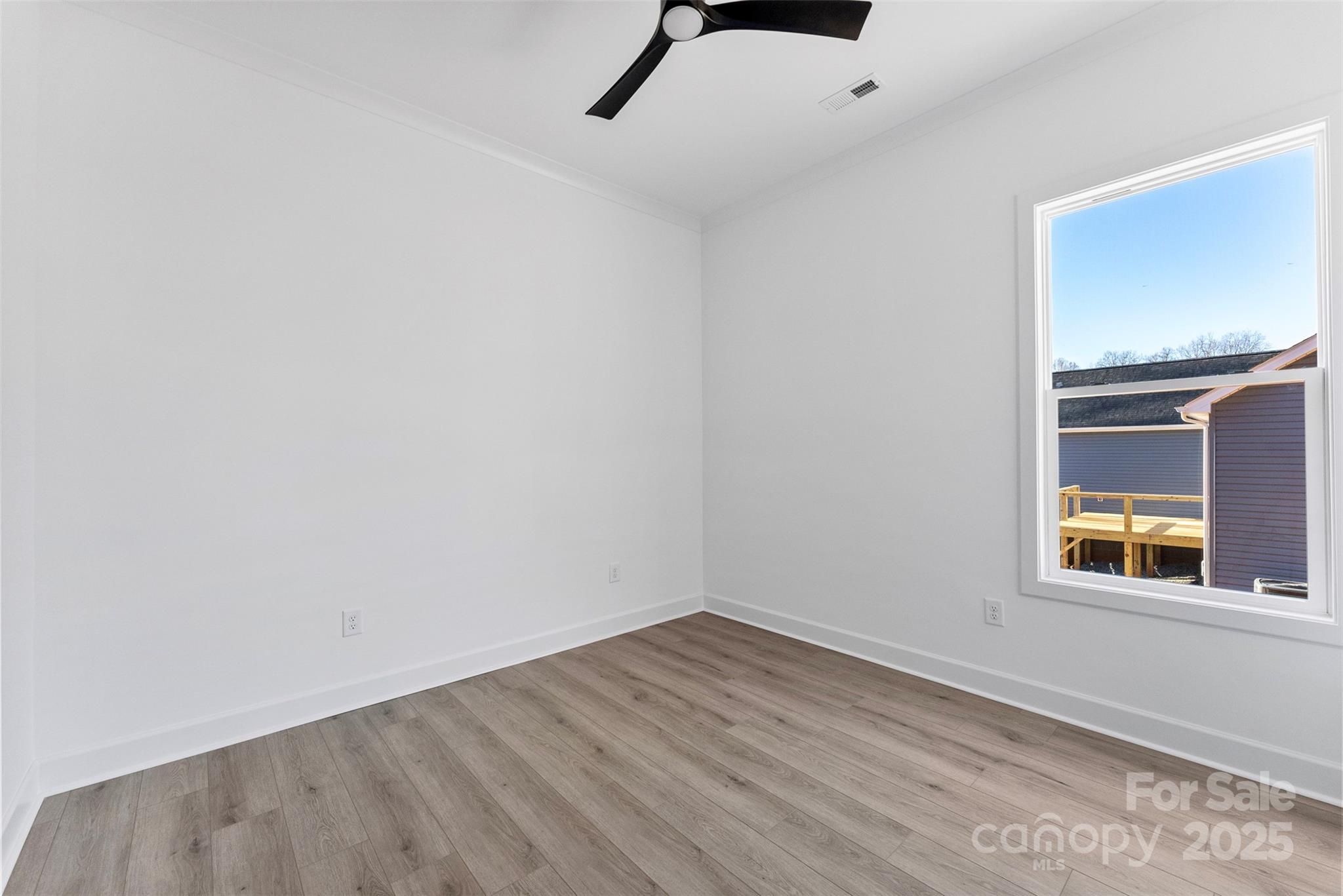 4005 Miller Road Salisbury, NC 28147 - Photo 27 of 46 a view of empty room with wooden floor and fan