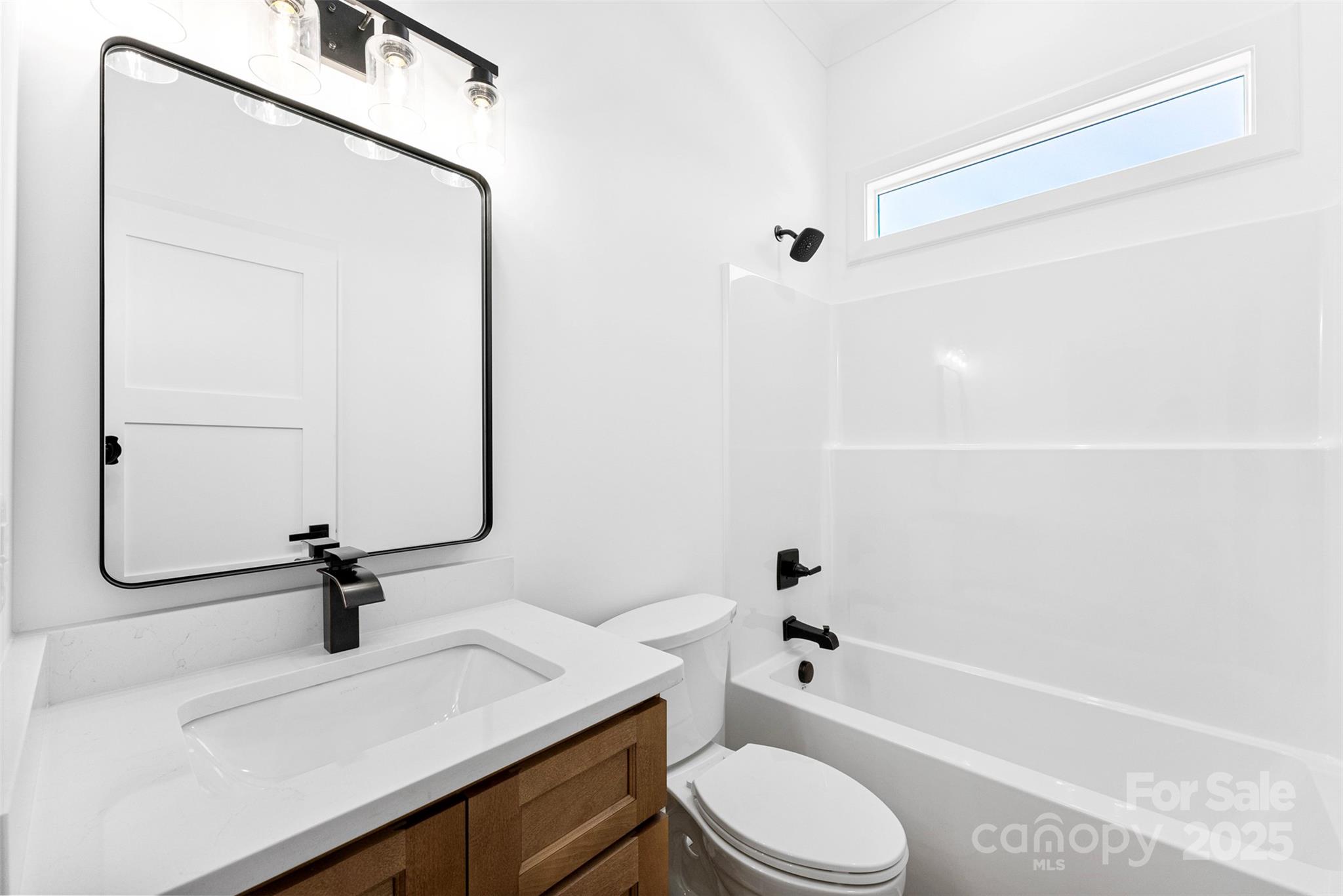 4005 Miller Road Salisbury, NC 28147 - Photo 29 of 46 a bathroom with a sink a toilet and a bathtub