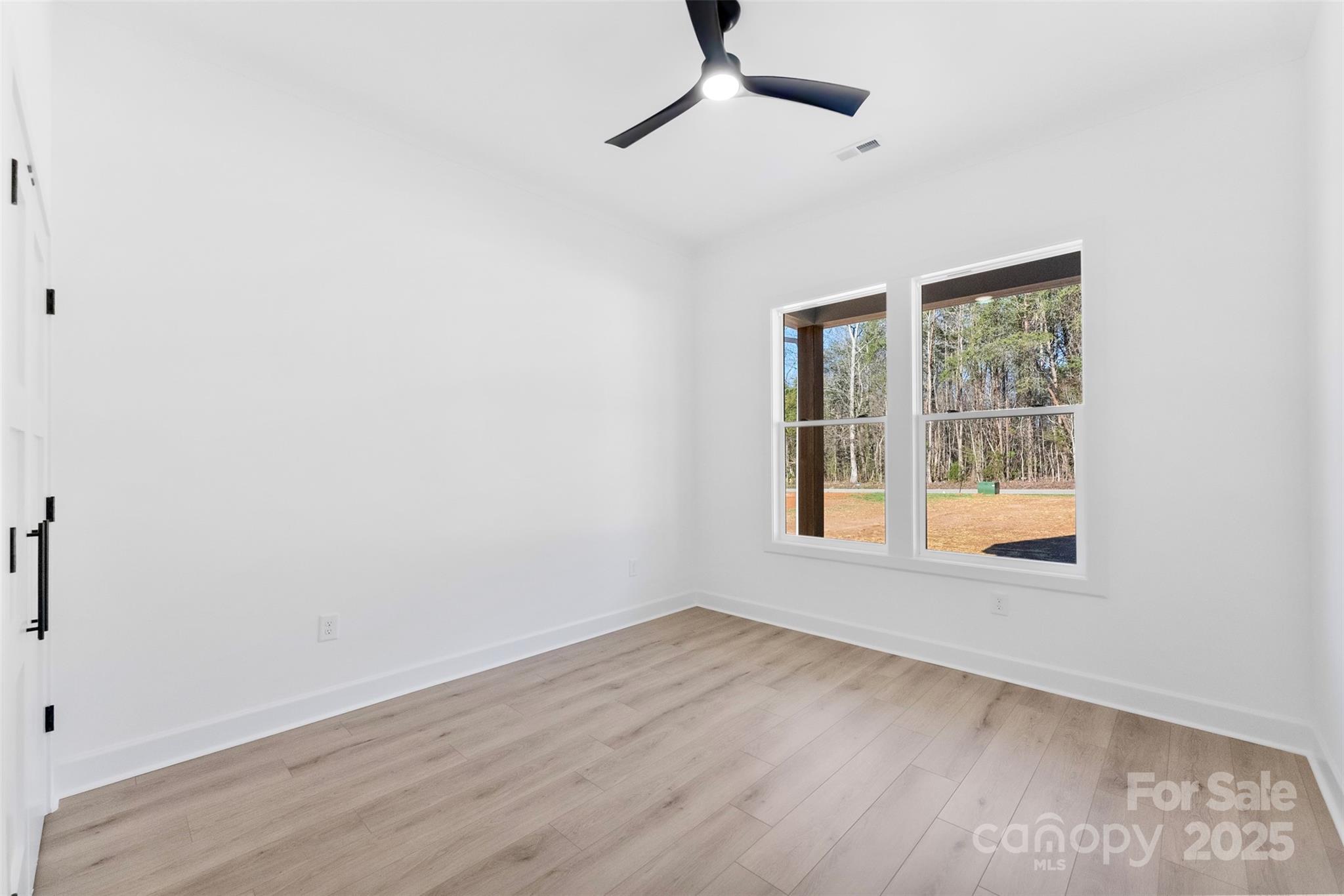 4005 Miller Road Salisbury, NC 28147 - Photo 30 of 46 a view of an empty room with wooden floor and a window