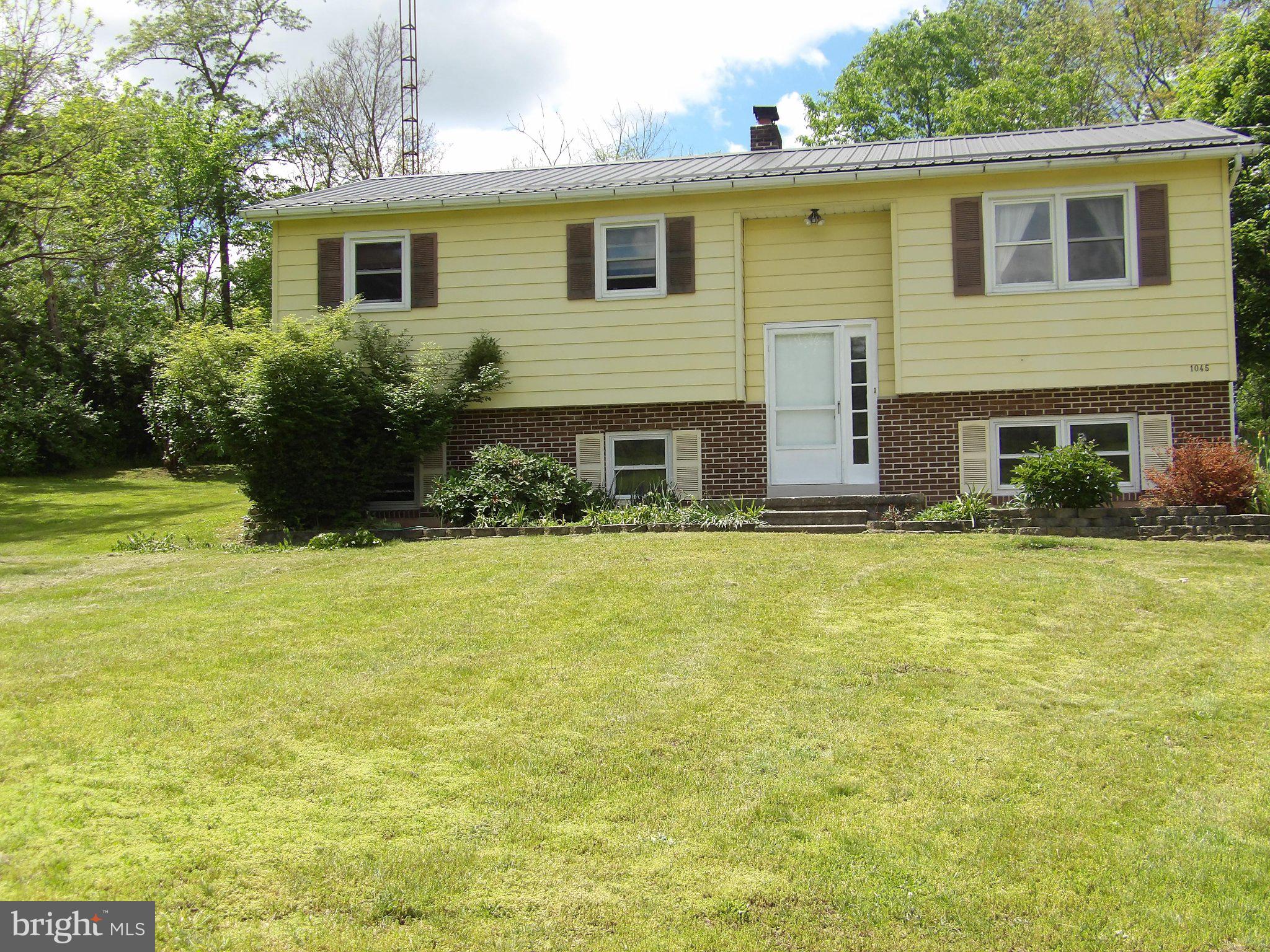 1045 Lockport Road Lewistown, PA 17044 - Photo 43 of 51 Charming split-level home with greenery.