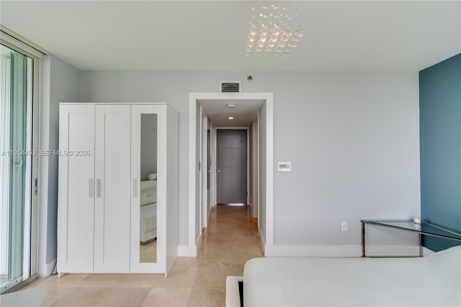 5900 Collins Avenue, Unit 1207 Miami Beach, FL 33140 - Photo 17 of 25 a living room with furniture and a window