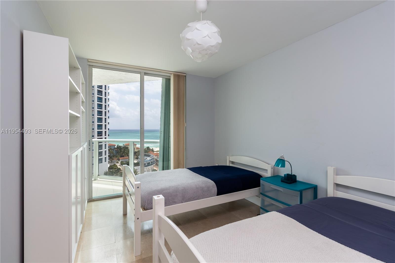 5900 Collins Avenue, Unit 1207 Miami Beach, FL 33140 - Photo 19 of 25 a living room with furniture and a window