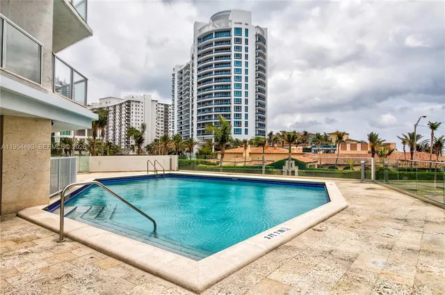 a view of a lake with tall buildings