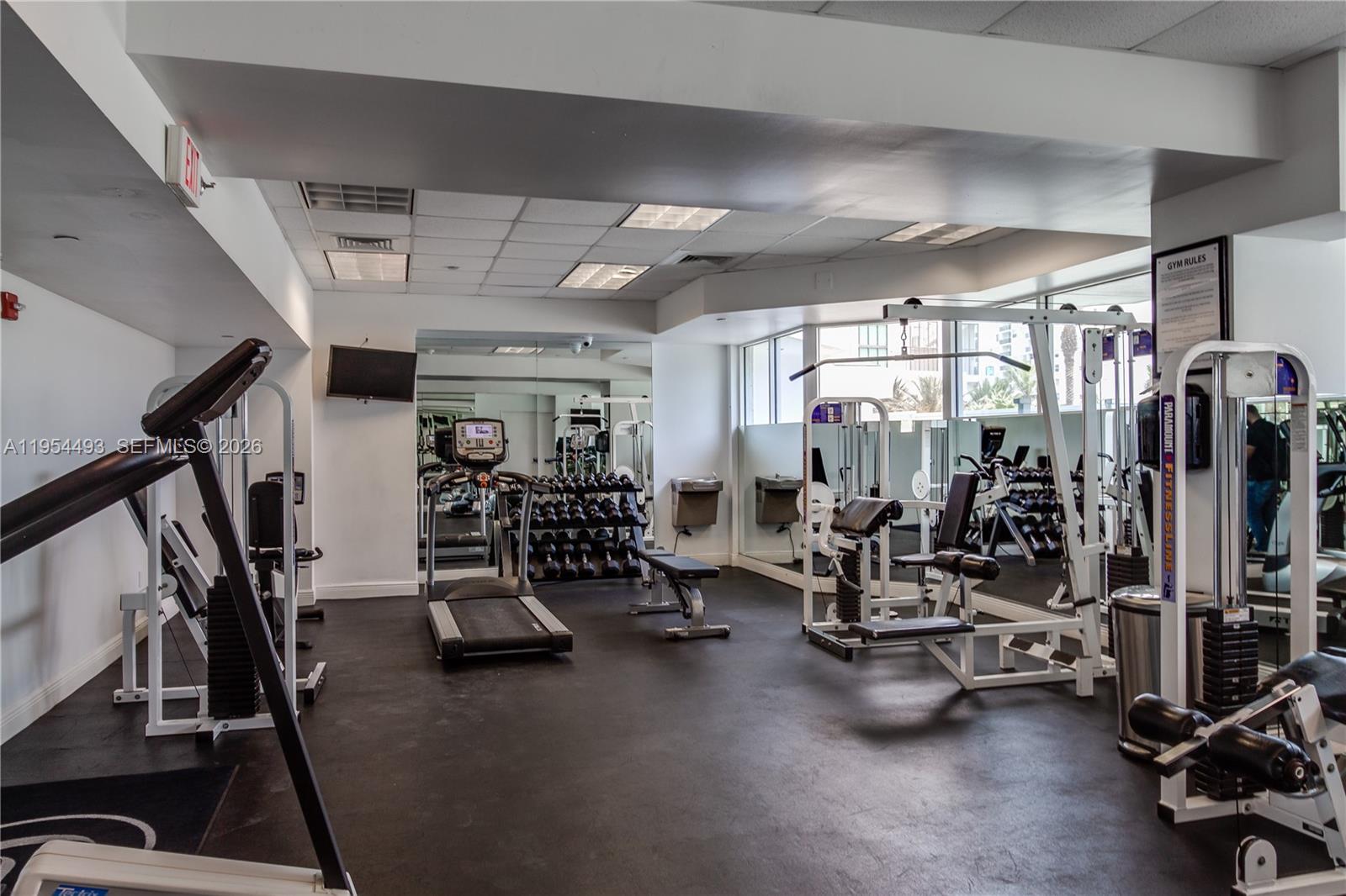 5900 Collins Avenue, Unit 1207 Miami Beach, FL 33140 - Photo 23 of 25 a view of a room with gym equipment