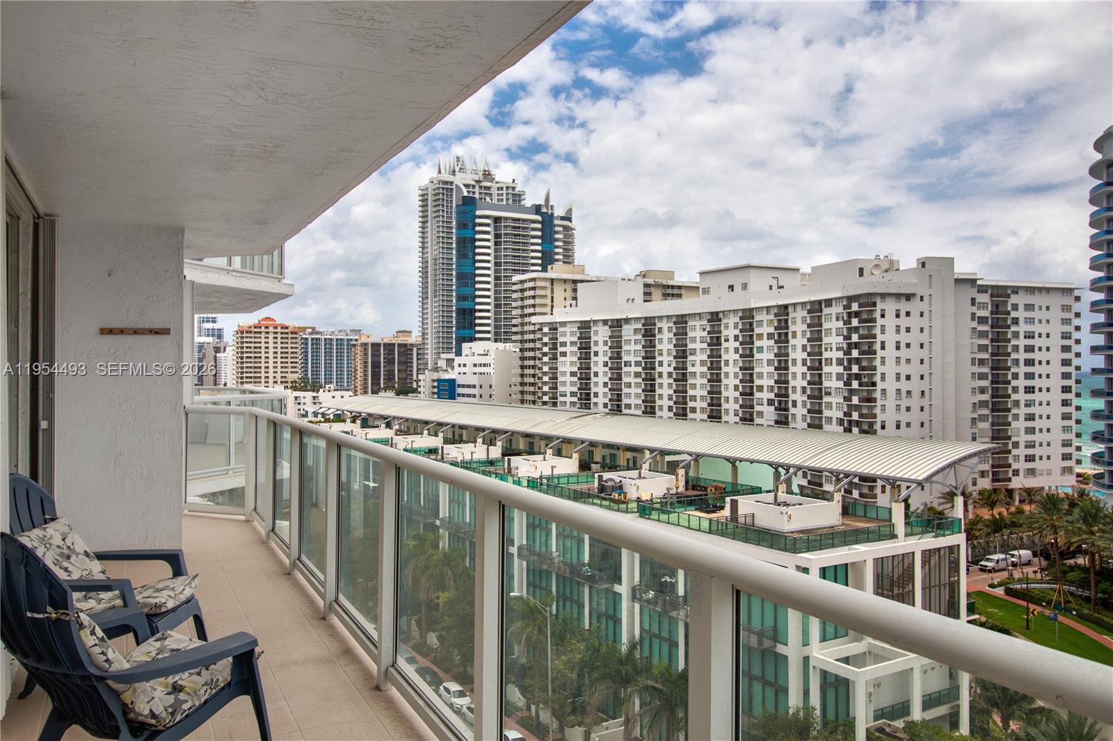 5900 Collins Avenue, Unit 1207 Miami Beach, FL 33140 - Photo 8 of 25 a balcony with city view