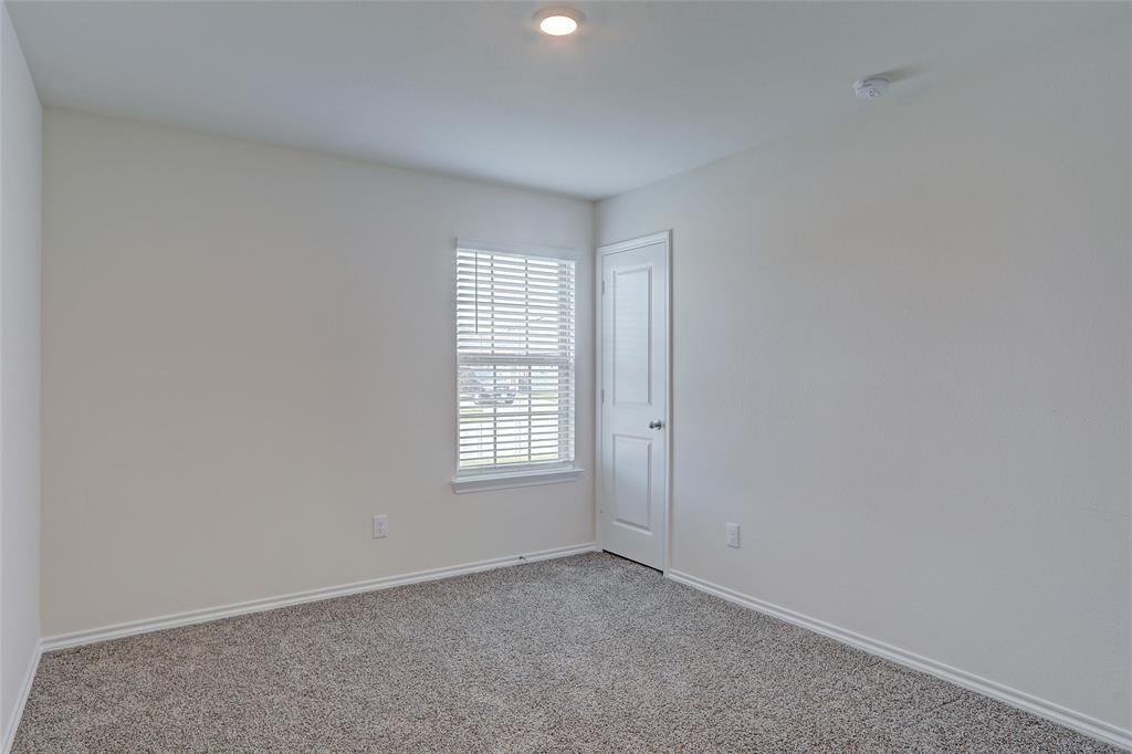 6517 Waterfall Lane Princeton, TX 75407 - Photo 11 of 19 an empty room with windows