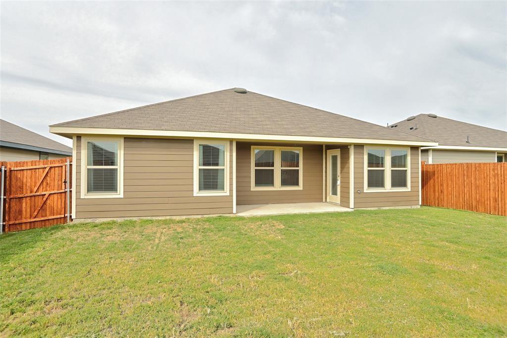 6517 Waterfall Lane Princeton, TX 75407 - Photo 17 of 19 a front view of a house with a garden