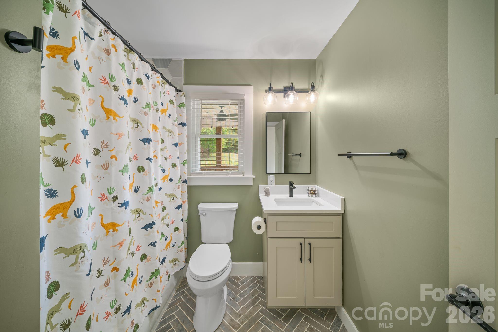 97 Paul Holland Road Canton, NC 28716 - Photo 23 of 35 a bathroom with a sink toilet and shower