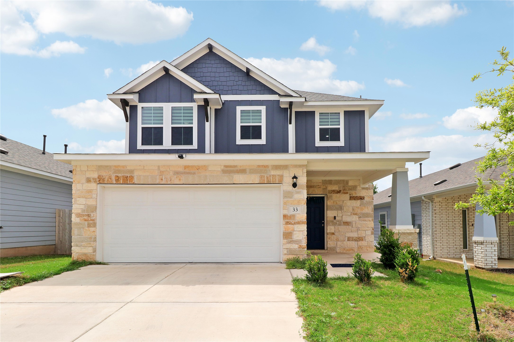 33 Bent Trl Lane Georgetown, TX 78628 - Photo 1 of 40 a front view of a house with a yard and garage