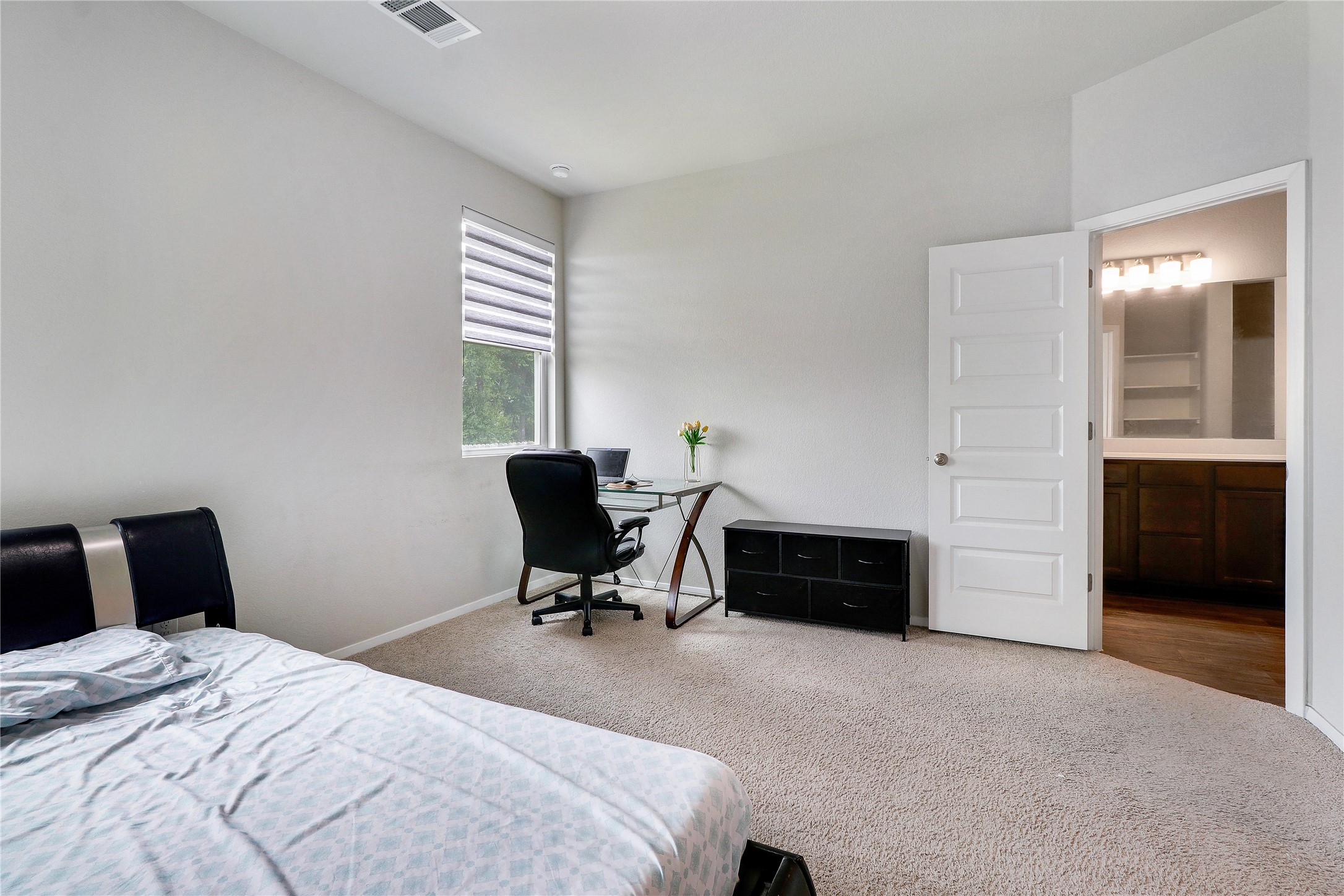 33 Bent Trl Lane Georgetown, TX 78628 - Photo 13 of 40 a bedroom with a bed and a window