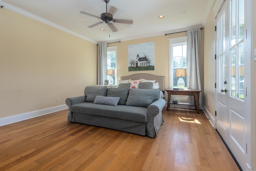 1915 Teague Store Road Somerville, TN 38068 - Photo 28 of 38 Hardwood flooring extends throughout this room, complemented by a ceiling fan with integrated lighting