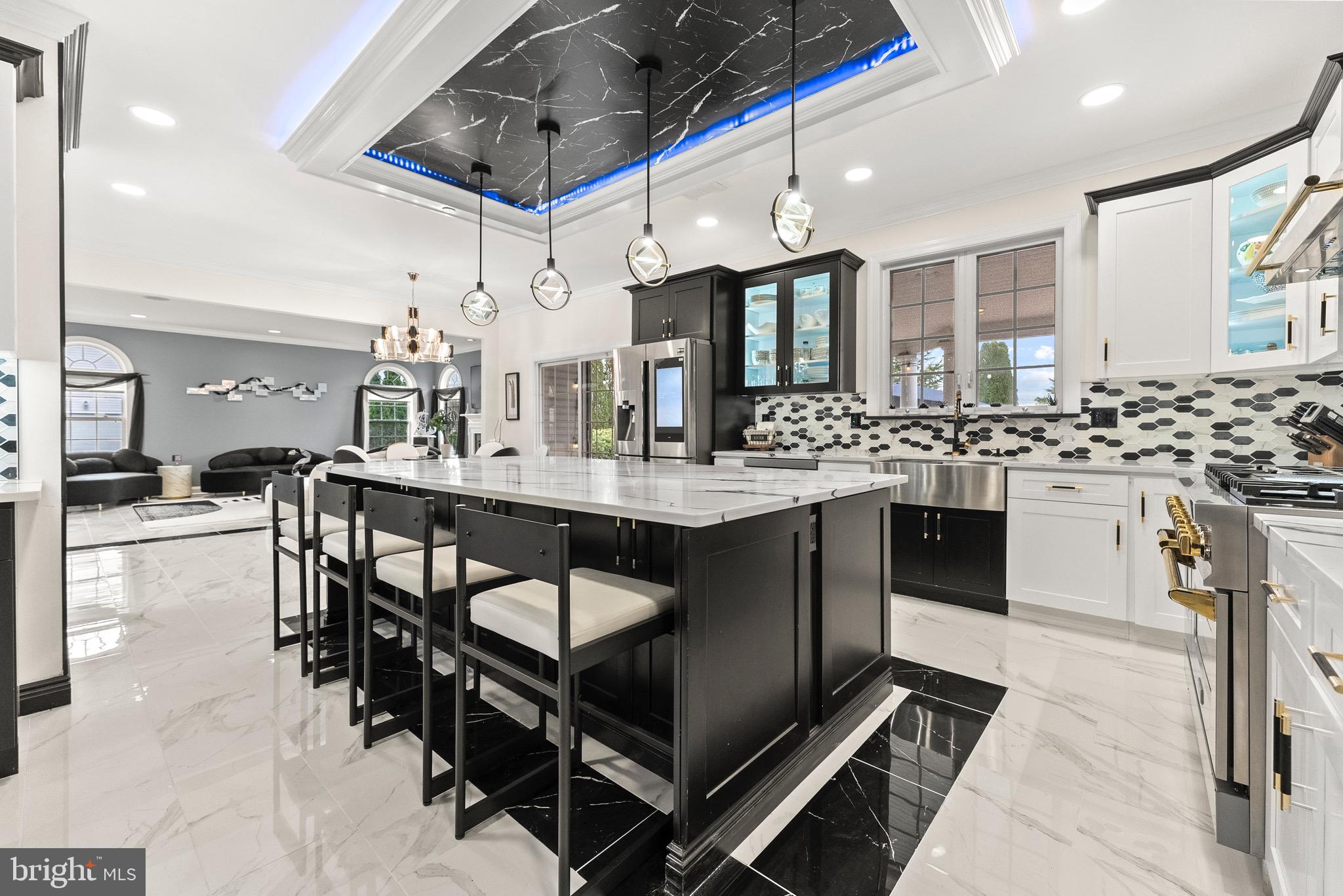 8 Sherwood Lane Columbus, NJ 08022 - Photo 12 of 85 a kitchen with stainless steel appliances kitchen island granite countertop a stove a sink a dining table and chairs