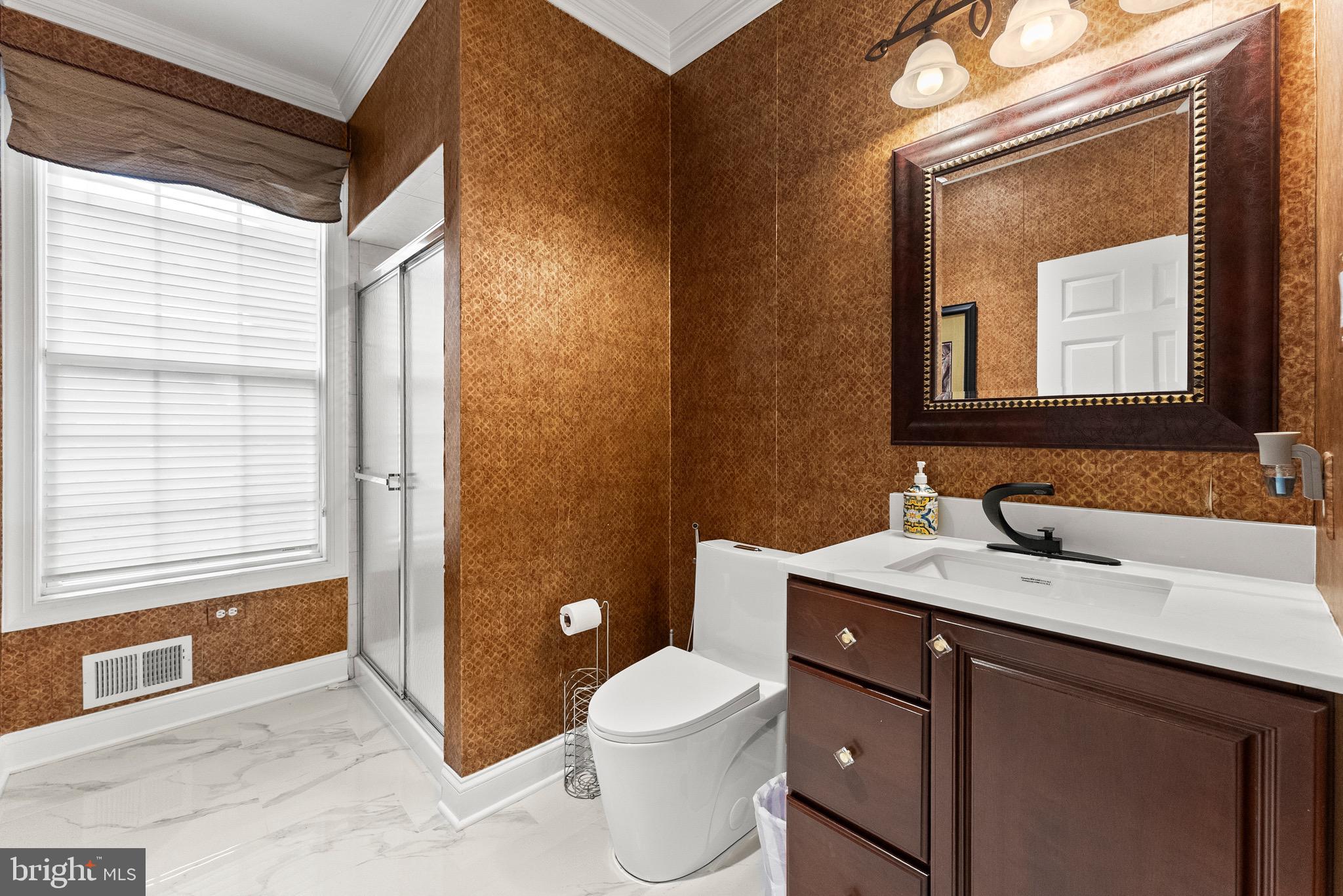 8 Sherwood Lane Columbus, NJ 08022 - Photo 41 of 85 a bathroom with a toilet a sink a mirror a window and vanity