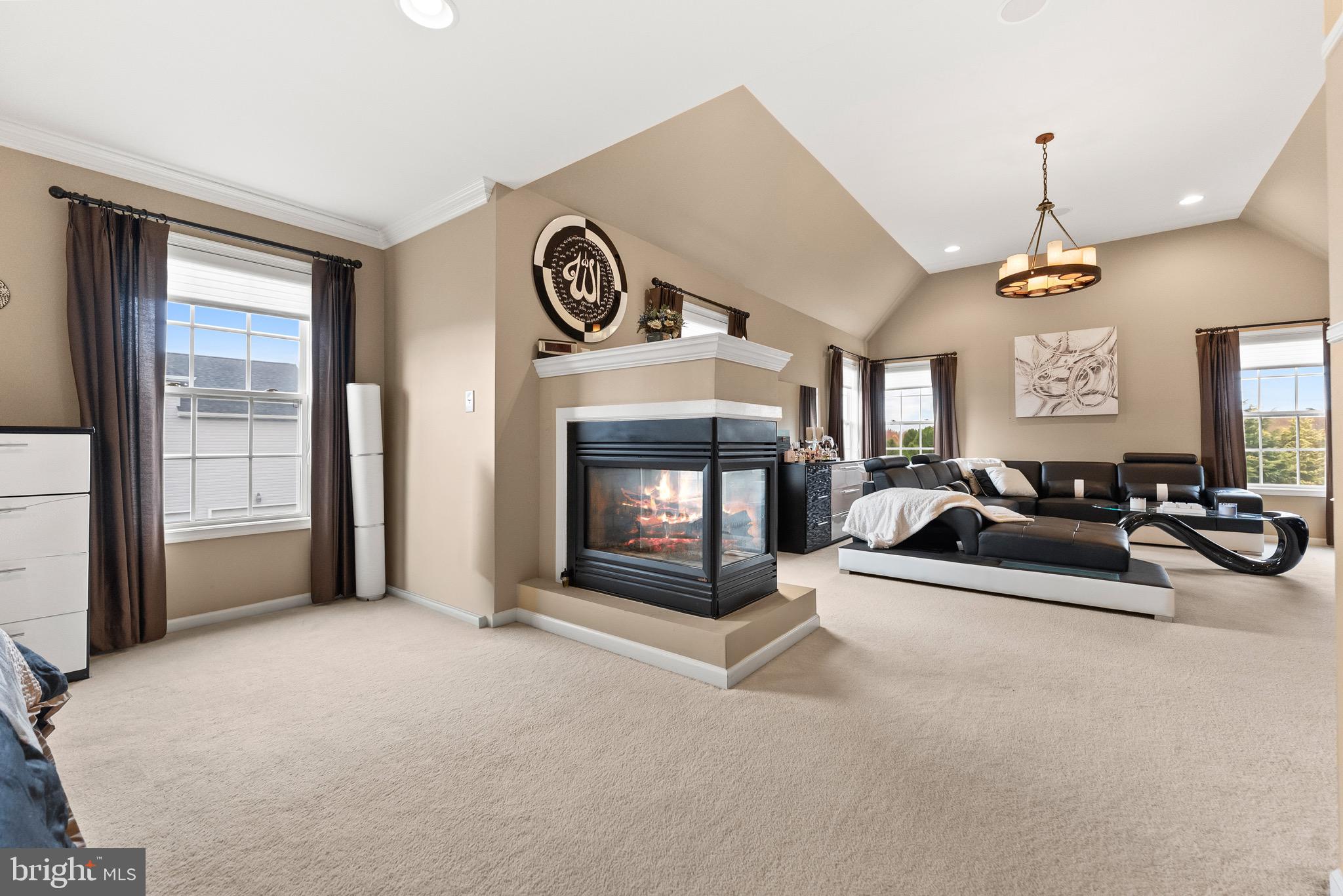 8 Sherwood Lane Columbus, NJ 08022 - Photo 48 of 85 a living room with furniture a fireplace and a chandelier