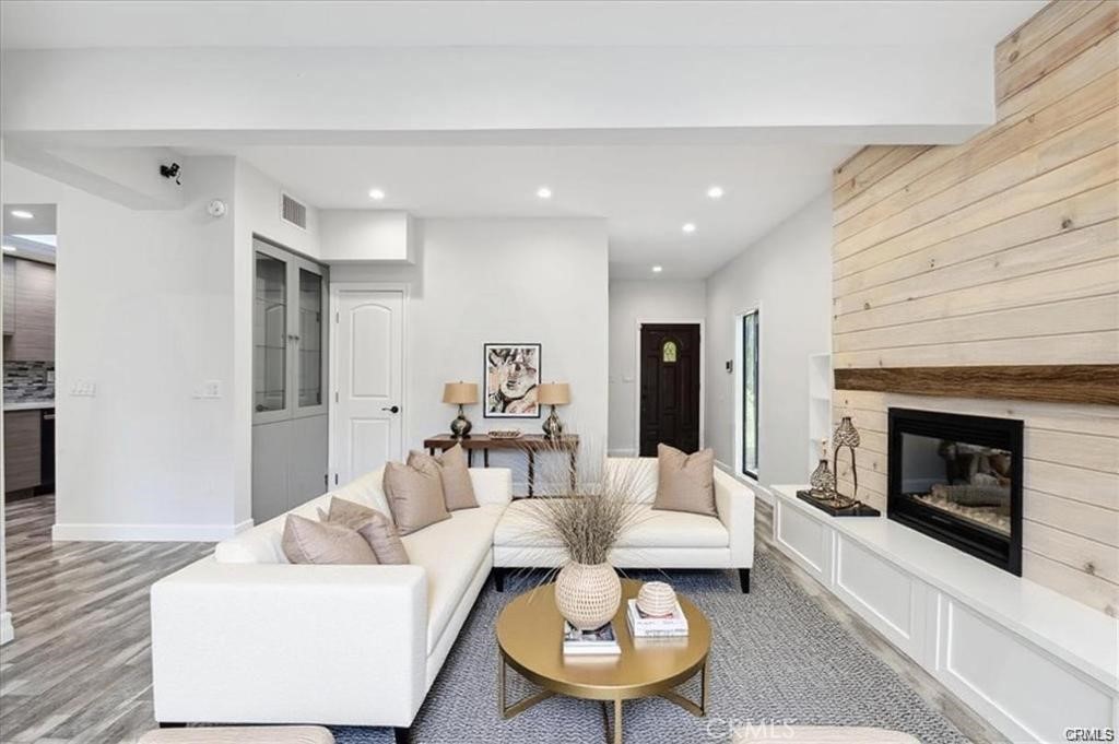10831 Roycroft Street, Unit 72 Sun Valley, CA 91352 - Photo 11 of 30 a living room with furniture and a fireplace