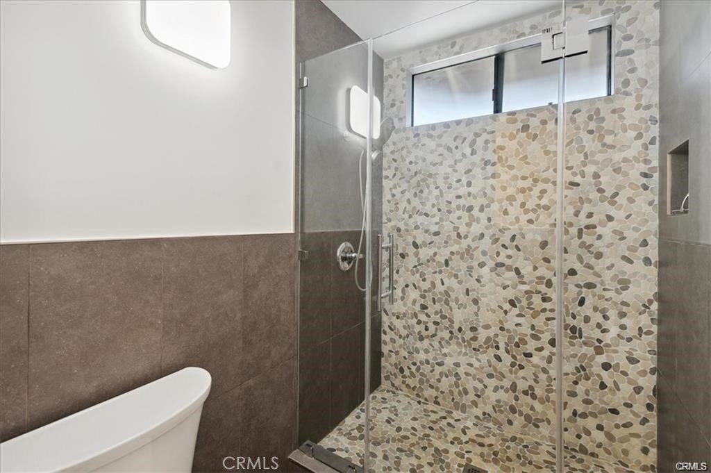 10831 Roycroft Street, Unit 72 Sun Valley, CA 91352 - Photo 21 of 30 a bathroom with a toilet and a shower