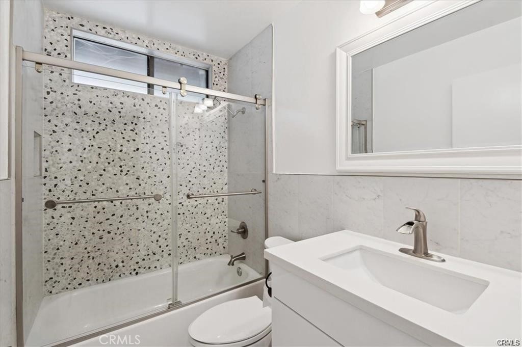 10831 Roycroft Street, Unit 72 Sun Valley, CA 91352 - Photo 25 of 30 a bathroom with a sink toilet and shower