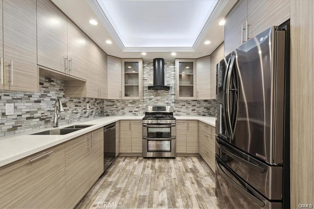 10831 Roycroft Street, Unit 72 Sun Valley, CA 91352 - Photo 8 of 30 a kitchen with stainless steel appliances a refrigerator sink and microwave