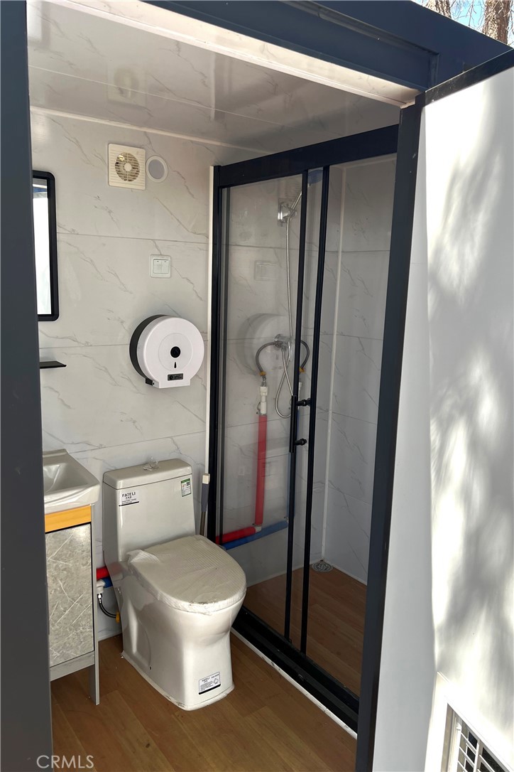 0 Jolon Road Bradley, CA 93426 - Photo 4 of 5 a white toilet sitting next to a bathroom sink
