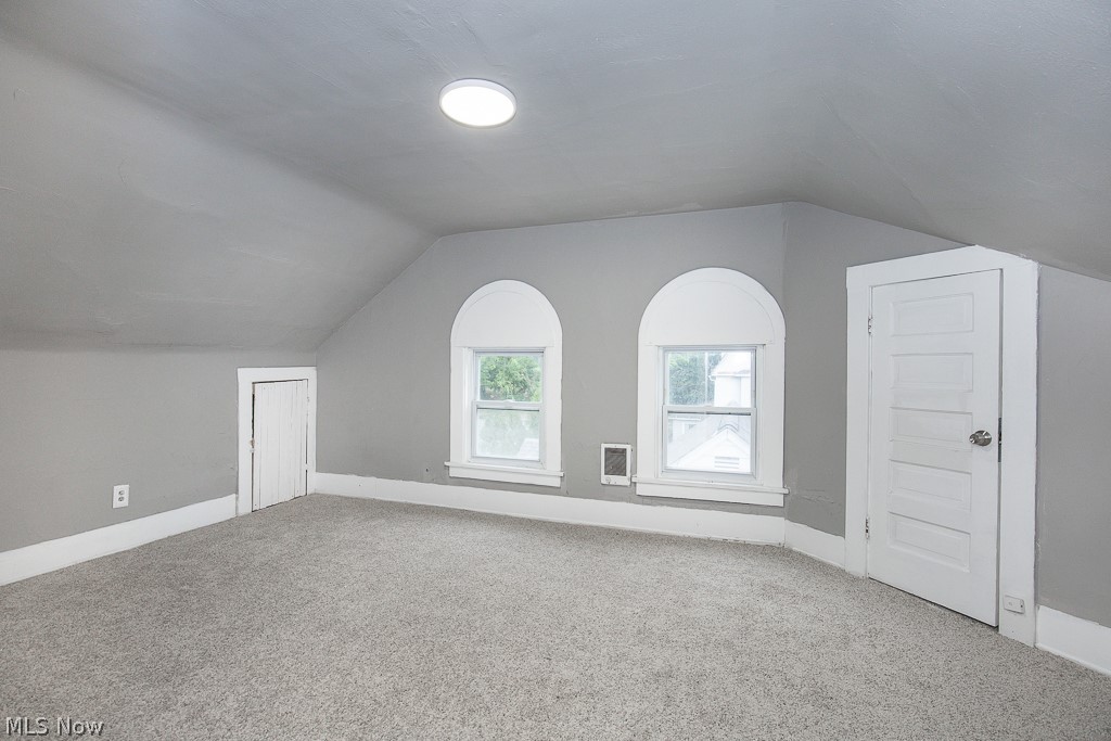1892 Beersford Road Cleveland, OH 44112 - Photo 40 of 47 Additional living space with vaulted ceiling and carpet