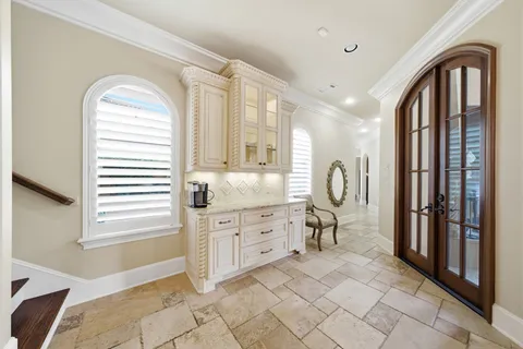 a spacious bathroom with a mirror a sink and a shower
