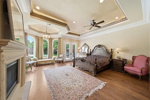 a living room with furniture a fireplace and a flat tv screen
