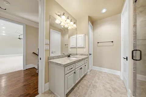 a bedroom with a bed a couch and a window