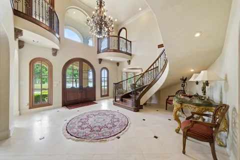 a view of entryway with a front door and wooden floor