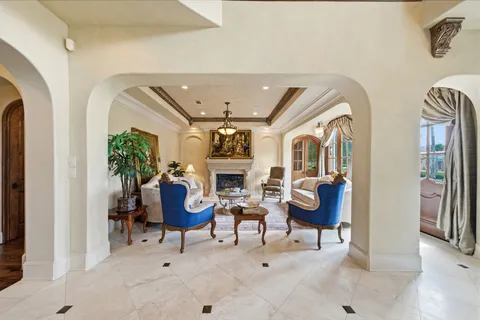 a view of living room kitchen and patio
