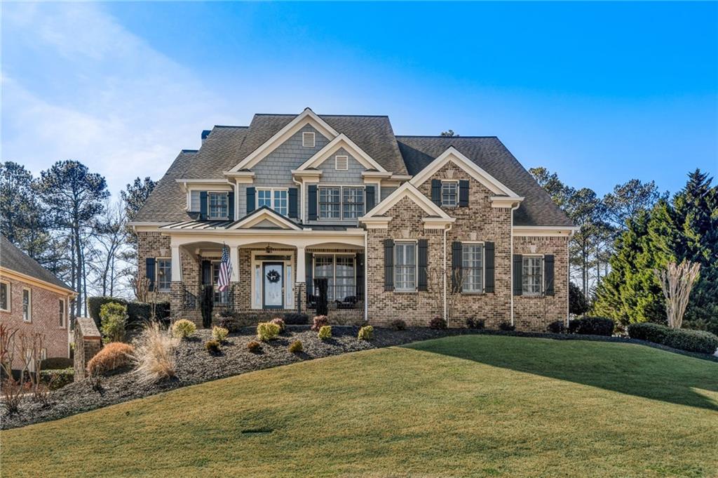a front view of a house with garden