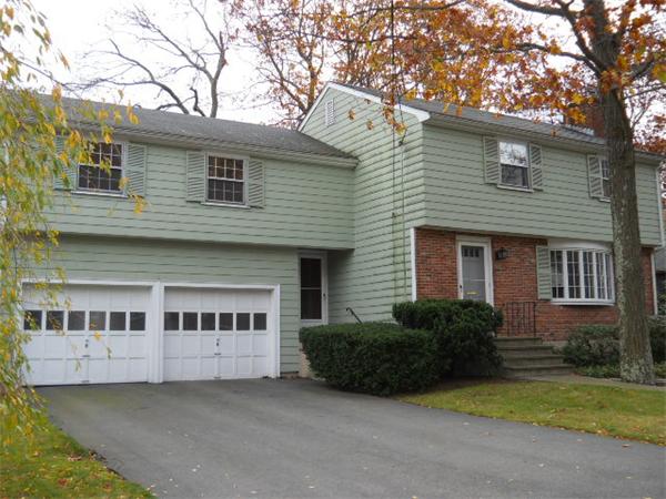 41 Gregory Road Wakefield, MA 01880 - Photo 1 of 24 a view of a house with a yard plants and large tree