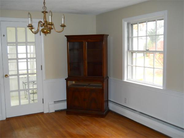 41 Gregory Road Wakefield, MA 01880 - Photo 12 of 24 a view of an empty room with wooden floor and a window