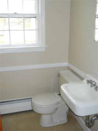 41 Gregory Road Wakefield, MA 01880 - Photo 16 of 24 a bathroom with a toilet and a sink