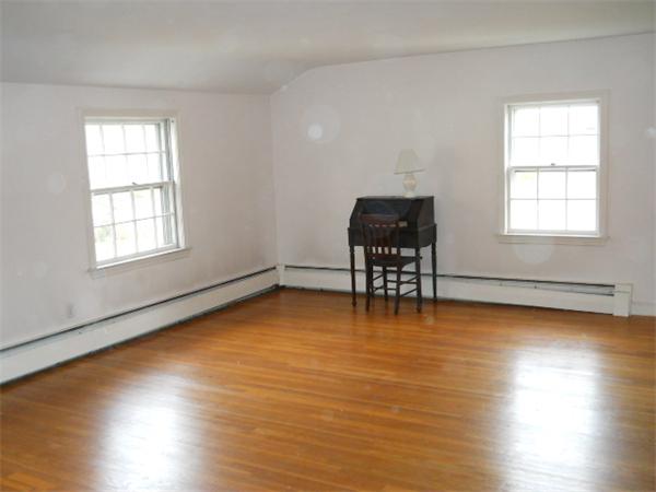 41 Gregory Road Wakefield, MA 01880 - Photo 19 of 24 an empty room with wooden floor and windows