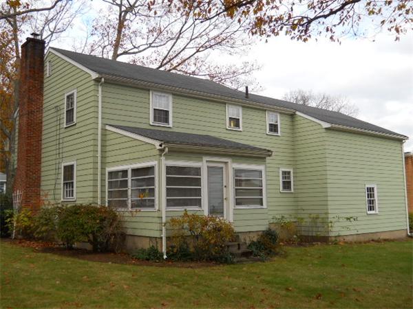 41 Gregory Road Wakefield, MA 01880 - Photo 2 of 24 a front view of a house with a garden