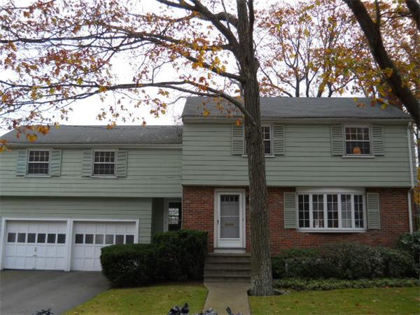 41 Gregory Road Wakefield, MA 01880 - Photo 24 of 24 a front view of a house with garden