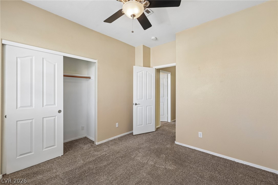 1727 Millstream Way Henderson, NV 89074 - Photo 39 of 46 A quiet bedroom offers plush carpet flooring and a convenient sliding door closet.