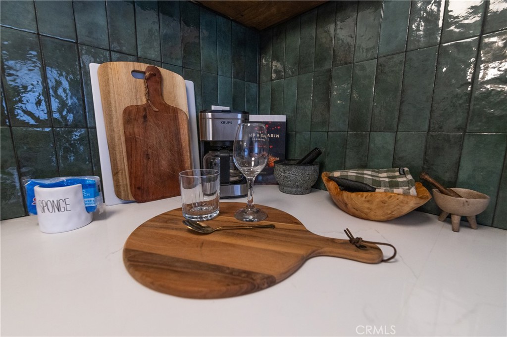 376 Riverside Avenue Sugarloaf, CA 92386 - Photo 13 of 28 a table and chairs in a room