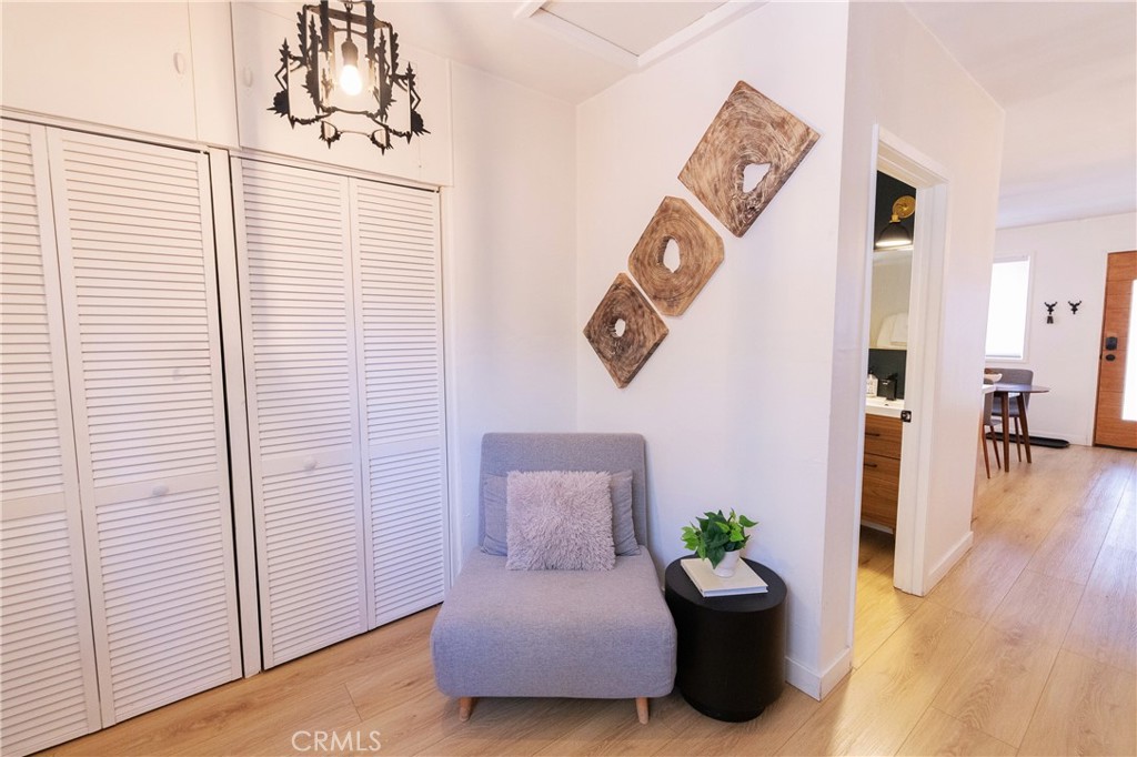 376 Riverside Avenue Sugarloaf, CA 92386 - Photo 25 of 28 a hallway with a couch and a potted plant