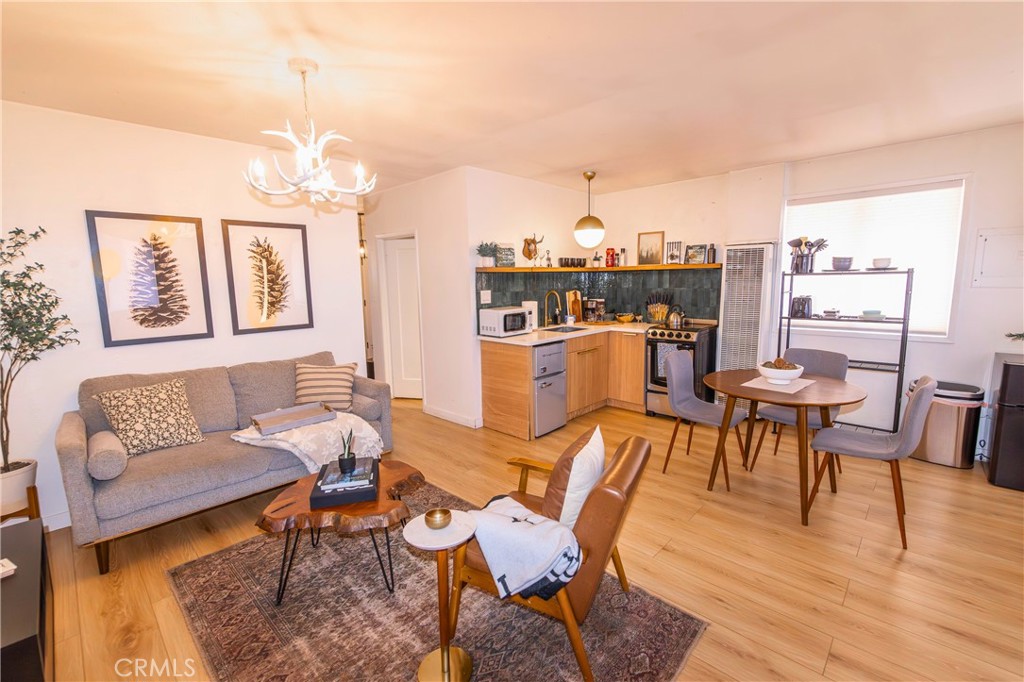 376 Riverside Avenue Sugarloaf, CA 92386 - Photo 9 of 28 a living room with furniture and a chandelier