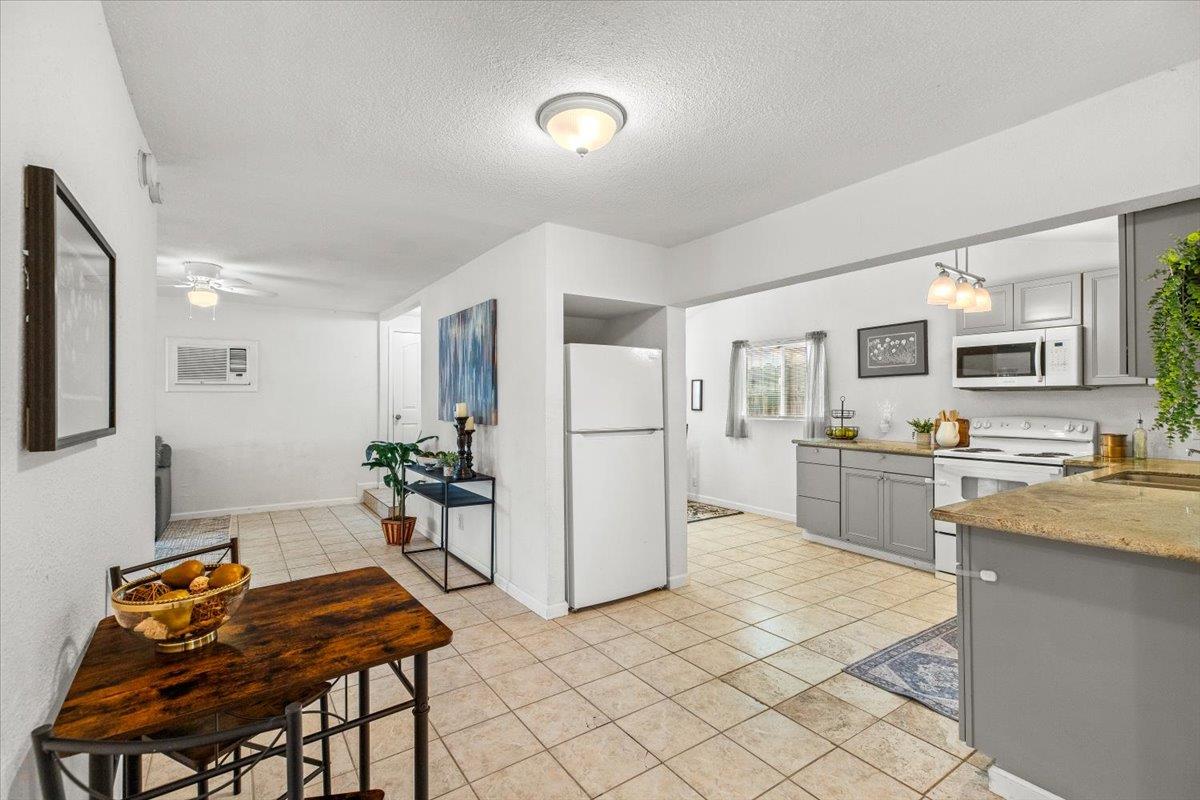 572 Pedersen Road Oakdale, CA 95361 - Photo 16 of 36 a kitchen with a refrigerator and a stove top oven